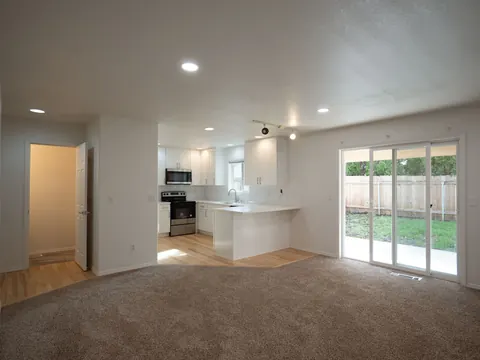 Open living space with a kitchen and patio doors
